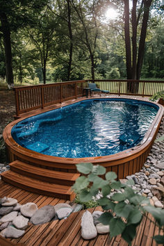 Image showing a budget-friendly deck built around an above ground pool Indoor Above Ground Pool Ideas, Over The Ground Pool Ideas, Above Ground Pool Australia, Diy Pool Pump Enclosure, How To Make Above Ground Pools Look Nice, Back Yard Pool Ideas, Overground Pool, Above Ground Pool Ideas On A Budget Diy, Cheap Pool Ideas