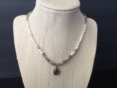 This is a stunning, luxury necklace made from high quality materials: labradorite, natural pearls, amethyst and pyrite gemstones. Crafted by hand, this is a piece to treasure for many years. The necklace is about 15.5” + 2”  extender, but please convo me if other length is desired.Perfect as a gift for someone you love or even for yourself for Birthday or any other special occasions like Mother's day, Valentines day, a wedding, or the celebration of an anniversary. ------------------------------ Adjustable Spiritual Pearl Necklace With Natural Stones, Bohemian Crystal Necklace With Pearl Charm As Gift, Labradorite Gemstone Beads Necklace Gift, Dainty Pearl Necklace With Gemstone Beads For Gift, Dainty Gemstone Beads Pearl Necklace Gift, Elegant Labradorite Necklace For Gift, Elegant Labradorite Necklace Gift, Natural Stones Pendant Pearl Necklace As Gift, Gift Pendant Pearl Necklace With Natural Stones