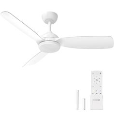 a white ceiling fan sitting next to a remote control