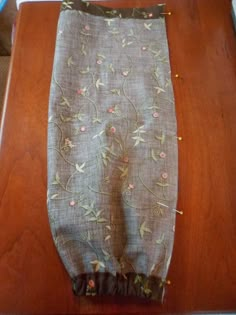 a piece of cloth sitting on top of a wooden table