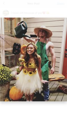 a man and woman dressed up in costumes standing on a porch next to each other