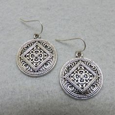 These adorable vintage southwestern style pierced earrings are very western in appearance. They are silvery metal with a tiny cz stone in the middle. They have French ear wires and measure 1 1/2 inches tall by 1 inch wide. They are in MINT condition with no maker's markings. These will arrive in a lovely gift box for easy gift giving or safe storage. If you like vintage costume jewelry, old silver, bolo ties and more, please check out my shop, www.etsy.com/shop/PANDPF Avon Rings, Bolo Ties, Southwestern Design, Arrow Design, Safe Storage, Southwestern Style, Vintage Avon, Pierced Earrings, Vintage Costume Jewelry