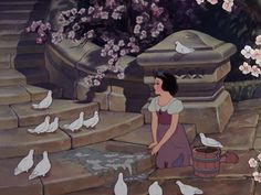 snow white and the seven dwarfs in front of some flowers with pigeons around her,