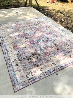 an old rug is sitting on the sidewalk