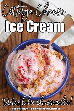 a blue bowl filled with ice cream on top of a wooden table