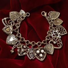 This charm bracelet is loaded with vintage style hearts and lockets from the 1950s and 1960s. Each charm is richly detailed and made in our studio. Finished in burnished bronze and silver, accented with crystal and seed pearls this charmer' will become your daily fav or a treasured gift for someone special to you. It sends it's message of love to all who admire it. Made at Sweet Romance in our Los Angeles studio. (Larger sizes have more hearts) How do I love thee? Let me count the charms... --pa 1950s Bracelet, Valentine Jewelry, Locket Bracelet, Vintage Charm Bracelet, Bridemaids Gifts, Gift Valentine, Locket Charms, Valentines Jewelry, Vintage Heart