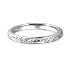 a white gold wedding band with engraved leaves