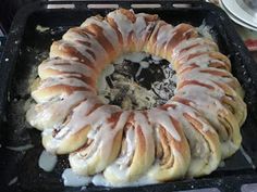 a bundt cake sitting on top of a pan covered in icing