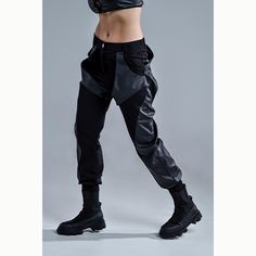 Unleash your inner warrior with our women's combat pants, designed for bold style and functionality. Crafted from premium twill fabric, these tech wear-inspired pants feature faux leather side panels and back pockets, adding an edgy touch to the design. With free-falling faux leather stripes on both the front and back, these calf-length pants are perfect for pairing with high boots. Ideal for street fashion and urban wear, these pants provide the ultimate combat-inspired look for any modern-day Tech Wear, Combat Pants, Inner Warrior, Womens Trousers, Free Falling, Women Street, Womens Pants, Bold Style, Urban Wear