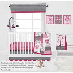 a baby crib bedding set with pink and gray designs on the sheets, pillowcases and curtains