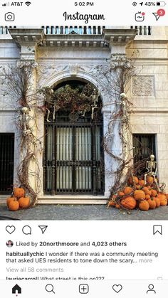 an instagramted photo with pumpkins and vines on the front of a building