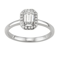 You'll adore the sleek style of this 14k white gold moissanite emerald-cut halo ring. RING DETAILS Width: 9.2 mm. Metal: rhodium-plated 14k white gold Includes: gift box & warranty card By Charles & Colvard  STONE DETAILS Stone type: lab-created moissanite Total weight diamond equivalent: 5/8 ct. Cut:emerald Setting: prong  Diamond equivalent carat (ct.) Total Weight (T.W.) represents the approximate total weight of diamonds of equivalent appearance.Please note, due to the high value of Classic Platinum Emerald Ring With Halo Design, Emerald Cut White Gold Diamond Ring With Halo, Classic White Emerald Ring With Halo Setting, Classic White Gold Emerald Ring With Halo Design, Classic Emerald Cut Diamond Ring With Halo Design, Classic Emerald-cut Diamond Ring With Halo Design, Platinum White Gold Emerald Ring With Halo Design, Formal White Gold Emerald Ring With Halo, Silver Platinum Emerald Ring With Halo Design