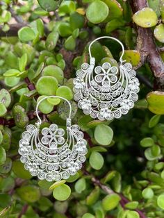 "DESCRIPTION: Mexican flower and filigree arracadas, hoop earrings.   The pair is beautifully decorated with intricate details.  Arracada earrings do not sit perpendicular to the head. They sit at a slight angle and sometimes you can see the back of the earring as you face a mirror. They are supposed to be that way. 1.8\" long x 1.4\" wide" White Bohemian Earrings With Intricate Design, Filigree Hoop Earrings For Weddings And Festivals, Wedding Festival Filigree Hoop Earrings, Handmade Ornate Hoop Earrings, Ornate Handmade Hoop Earrings, Traditional White Hoop Earrings With Ear Wire, White Bohemian Filigree Earrings, Bohemian Hoop Earrings With Intricate Design For Wedding, Elegant Festival Hoop Earrings With Intricate Design