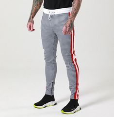 Street Style Black Stretch Jogging Bottoms, Stretch Black Jogging Bottoms, Black Stretch Hip Hop Pants, Stretch Hip Hop Gym Pants, White Training Bottoms With Side Stripes, Stretchable Black Jogging Bottoms, Black Cotton Sweatpants For Training, Black Gym Joggers, Black Athletic Pants For Gym