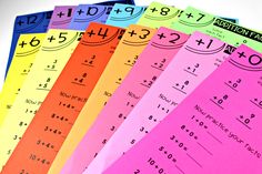 six colorful sheets of paper with numbers and times on them