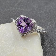 Lovely Estate, Chuck Clemency, 7mm Heart Cut Amethyst and Diamond Accent 925 Sterling Silver Ring. This beautiful ring is sure to receive many compliments! SOLID925 STERLING SILVER, FULLY TESTED, NOT PLATED OR FILLED. Ring Size: 4.75 Width: 9mm - 1.5mm Gemstone: Amethyst / Diamond Weight: 1.8 Grams Hallmarked: STS / 925 We gladly combine shipping! Everything is packed with care to make sure it arrives safely. We only sell authentic items. If it is a name brand item, we guarantee it to be authent Valentine's Day Purple Amethyst Promise Ring, Amethyst Heart Cut Ring For Anniversary, Purple Amethyst Birthstone Ring For Valentine's Day, Fine Jewelry Purple Amethyst Ring For Valentine's Day, Fine Jewelry Amethyst Ring For Anniversary On Valentine's Day, Purple Heart Ring With Accent Stones For Anniversary, Purple Amethyst Heart Cut Ring For Valentine's Day, Amethyst Heart Cut Promise Ring For Valentine's Day, Purple Heart Amethyst Ring With Accent Stones