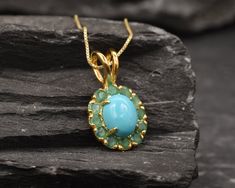 Gold Turquoise Pendant set with a Genuine Natural Arizona Turquoise (Sleeping Beauty) in a stunning clean grade, surrounded by Natural Emeralds. Gold Flower Pendant design is made of Gold Vermeil ☞ thickest 18k Gold Plating on top of Solid 925 Sterling Silver ☞ made to last. Free Gold Vermeil Chain with every Pendant order, 18 inch Gold Vermeil chain (46 cm) ✓ December Birthstone - Genuine & Natural Stones ❀ ⌛Last Pendants left ⌛ Matching Ring: www.etsy.com/uk/listing/1029820990 Matching Earring Turquoise Fine Jewelry Gemstones As A Gift, Turquoise Gemstones For Gift, Fine Jewelry Style, Elegant Turquoise Chrysoprase Necklace, December Birthstone Necklace, Blue Topaz Pendant, Arizona Turquoise, Ruby Pendant, Rose Pendant, Gold Flower