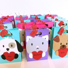 there are many small bags with animals on them that have hearts in the shape of cats and dogs