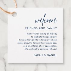 a white card with the words welcome friends and family written in cursive font