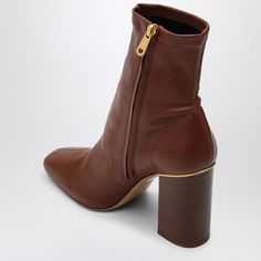 Hey there. Looking for that perfect pair of cognac leather boots to elevate your wardrobe? These ankle beauties blend classic style with modern flair, making them a versatile addition to any outfit. Plus, they’re crafted with care, so you know they’ve got the quality to match their gorgeous looks. Rich cognac-colored leather Chic square toe design Easy-to-use inner side zip Sturdy thick wood-effect high heel Durable leather sole Made in Italy 100% calf leather composition | Chloé Women's Ambre A Dr Closet, Leather Cap, Brown Ankle Boots, Boot Pumps, Colored Leather, Beach Tote Bags, Sneaker Heels, Womens Boots Ankle, Handbag Backpack