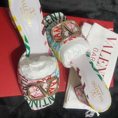 These Are Gorgeous White And Multi-Colored Logo Slides. Brand Name New And Never Worn. Designer White Sandals With Buckle Closure, Designer White Open Heel Mules, Luxury Multicolor Sandals For Spring, Luxury Multicolor Open Heel Sandals, Designer Mules With Buckle Closure For Spring, Luxury Multicolor Heels For Summer, Luxury Multicolor Summer Heels, Designer White Heels With Buckle Closure, Designer Summer Mules With Block Heel