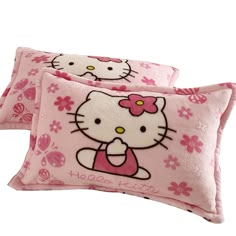 two pink pillows with hello kitty on them