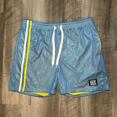 Item Is Nwt. Color Is Blue And Yellow. Material Is Cotton (50%) And Polyester (50%). Size Is A Men’s Xl (Measures 32). Inseam Measurement - 4” Total Length - 17” Rise - 13” Leg Opening - 12.5” Np516 Blue Athletic Shorts With Elastic Waistband For Vacation, Blue Athletic Shorts With Built-in Shorts For Summer, Blue Athletic Shorts With Elastic Waistband For Beach Season, Blue Athletic Shorts For The Beach, Blue Sports Shorts For Summer, Light Blue Sports Shorts For Summer, Light Blue Sporty Athletic Shorts For Summer, Casual Blue Athletic Shorts For Vacation, Blue Beachwear Athletic Shorts For Summer