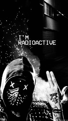 a black and white photo of a person wearing a mask with the words i'm radioactive on it