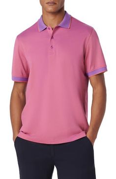 Mercerized cotton brings softness and polish to a polo crafted from a breathable piqué knit and framed in bright tipping at the collar and sleeves. 28" length Button half-placket Short sleeves 100% cotton Machine wash, dry flat Imported Classic Pink Collared Polo Shirt, Classic Pink Polo Shirt, Classic Pink Top With Ribbed Collar, Pink Cotton Polo Shirt With Polo Collar, Classic Fitted Pink Polo Shirt, Sporty Pink Collared Polo Shirt, Fitted Pink Sporty Polo Shirt, Fitted Purple Polo Shirt With Polo Collar, Classic Fitted Purple Polo Shirt