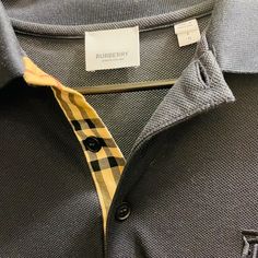 Brand New Burberry Polo Shirt Navy Large Not Worn Designer Black Top With Collared Neckline, Luxury Business Polo Collar Tops, Luxury Business Tops With Polo Collar, Luxury Business Tops With Collar, Designer Black Tops With Spread Collar, Designer Black Top With Spread Collar, Designer Black Polo Shirt For Work, Designer Black Business Tops, Designer Black Tops For Business