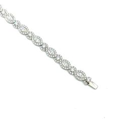 This stunning diamond tennis bracelet features 287 mixed cut diamonds that boast E/F in color and VS1/VS2 in clarity. Set in 18k white gold, it is a gorgeous piece to add to any jeweler's collection. Silver Round Diamond Bracelet With Baguette Diamonds, Silver Baguette Diamond Tennis Bracelet, Dazzling Silver Baguette Cut Diamond Bracelet, Sparkling Diamond Bracelet In White Gold, Dazzling Cubic Zirconia Diamond Bracelet With Pave Setting, Silver Baguette Diamond Tennis Bracelet For Wedding, Silver Tennis Bracelet With Baguette Diamonds, Wedding Tennis Bracelet With Baguette Diamonds In Diamond White, Diamond White Tennis Bracelet With Baguette Cut