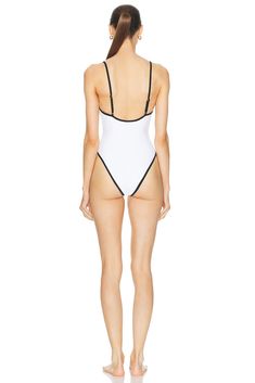 Find LPA Alessa One Piece In White on Editorialist. LPA Alessa One Piece in White Self: 80% polyamide 20% elastane Lining: 100% polyester. Made in Indonesia. Hand wash. Adjustable shoulder straps. LPAR-WX245. LPX270 U24. About the designer: Since its launch in 2016, the eponymous LPA label perfectly translates its elevated yet casual aesthetic into a cohesive vision. Epitomizing feminine Italian romance meets California tomboy, the ready-to-wear collection fashioned by Lara Pia Arrobio encapsulates the quintessential cool girl spirit with a raw, unapologetic attitude. Sporty Second-skin Swimwear Made Of Elastane, Sporty Second-skin Elastane Swimwear, Black Polyamide Swimwear For Sports, Black Polyamide Sports Swimwear, Sports Second-skin Nylon Swimwear, Workout Swimwear With Minimal Stretch, White Compressive Swimwear For Summer, Spring Elastane Swimwear, Second-skin Elastane Swimwear For Spring