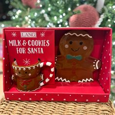 two gingerbreads in a red box on a wicker table