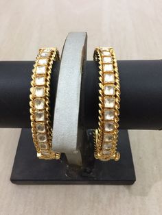 *This is Gold Finish Kundan Bangles pair.Its Perfect for Wedding Occasion as well as Unique and Ethnic Traditional Bangle to gift and Also Bridal wear to match with Wedding Outfits. *Its made from Silver n Copper mix material and 100% Handmade. *Its available in Various Sizes like 2,2.2,2.4,2.6 Etc Its white kundan combination like shown in picture. *Its open able Screwed Bangles Pair. *All Kundan stones set with silver foils handsetting method and long last guarantee of its workmanship.It is Wh Stone Work Bracelets For Diwali Reception, Bollywood Style Bracelets With Intricate Design For Receptions, Bollywood Style Bracelets For Reception With Intricate Design, Stone Work Bracelets For Reception And Diwali, Bollywood Style Intricate Bracelets For Reception, Temple Jewelry Bangle With Stone Work For Reception, Traditional Meenakari Bracelets For Reception, Traditional Heavy Bangle For Reception, Festive Bangle With Intricate Design For Reception