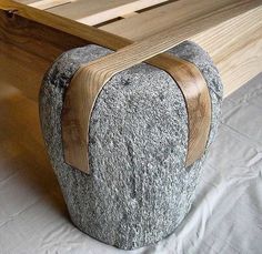 a bench made out of rocks and wood