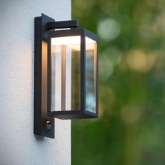 an outdoor light mounted on the side of a building