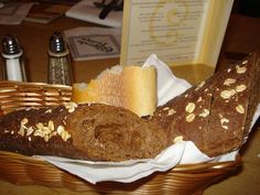 a basket filled with bread and other food items