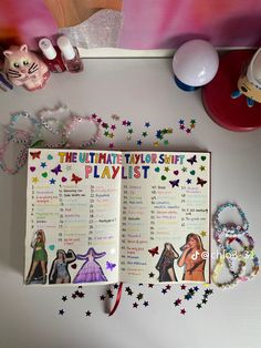 the ultimate taylorie's playlist is displayed on a table