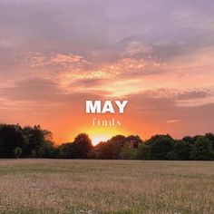 a field with trees and the words may finds in front of an orange sky at sunset