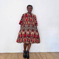 The pointer dress is fun! Our loose fit colourful dresses made out of non-stretchy African print are perfect for you in case you are looking for a style idea that is versatile, comfortable, and looks fabulous year-round. All materials used to design the dresses are sourced in Kenya.  MEASUREMENT GUIDE:  We recommend asking questions about sizes or you can take your own measurements (at the bust) if unsafe. Since its an A- Line, you only need to ensure that you have the right fit for the bust. Pl Casual A-line Dress With Abstract Print, Casual Knee-length Dress With Colorful Pattern, Casual A-line Dresses With Vibrant Print, Casual A-line Dress With Vibrant Print, Red Short Sleeve Dress With Colorful Pattern, Multicolor Short Sleeve Dress With Pockets, Short Sleeve Bold Multicolor Print Dress, Multicolor Bold Print Short Sleeve Dress, Red Dresses With Pockets Relaxed Fit