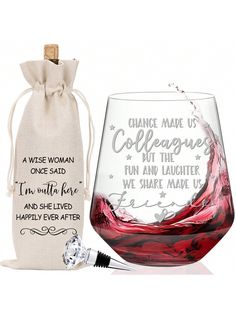 a wine glass next to a bag filled with red wine