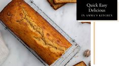 a loaf of banana bread sitting on top of a cooling rack next to some nuts