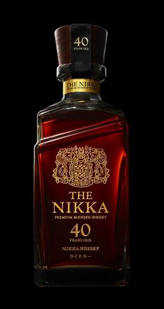 the nikka 40 year old bottle is shown in front of a black background with gold lettering