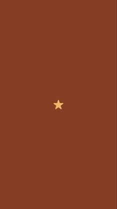 a brown book with gold stars on the cover