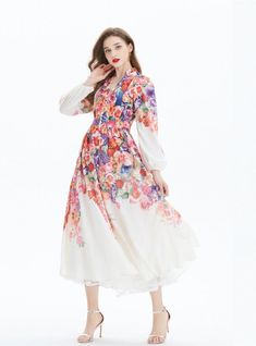 Bathed in a tapestry of floral splendor, this long-sleeved maxi dress radiates a romantic aura fit for any dreamy occasion. With its rich mosaic of vibrant blossoms that cascade from the shoulders to the hem, the dress evokes the splendor of a flourishing garden. The bodice, graced with a deep v-neckline, gives way to a cinched waist, where the pattern converges to flatter the figure before flowing out into an A-line skirt that whispers of elegance with every movement. The sheer sleeves billow gently to the wrists, offering a hint of whimsy and grace. This dress is a wearable piece of art that calls to those who carry an appreciation for nature’s beauty and a love for fashion that makes a statement. Pattern: printingStyle: pulloverSkirt length: long skirtSkirt type: large swing typeCollar Modest Long Sleeve Long Dress For Spring, Fall Bohemian Floral Dress For Garden Party, Bohemian Style Floral Maxi Dress For Fall, Bohemian Floral Maxi Dress For Fall, Flowy Long Sleeve Dress For Spring, Floral Print Long Maxi Dress For Fall, Floral Print Long Sleeve Dress For Fall Garden Party, Long Floral Print Midi Dress, Floral Print Maxi Dress For Fall