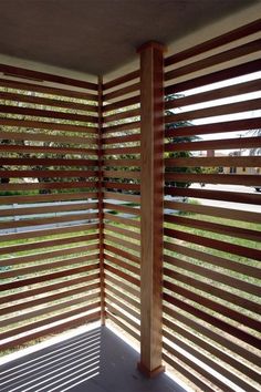 a wooden slatted wall on the outside of a building