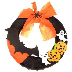 a halloween wreath with bats and pumpkins on it