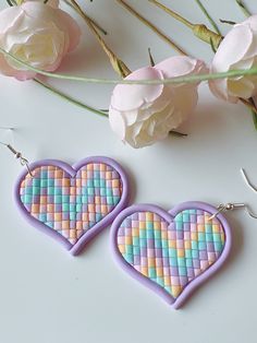 Heart earrings in bargello design with pastel colors, and soft purple border to accentuate the heart shape. Everyday will be a happy heart's day whenever you will wear or see these cute earrings. They are lightweight and will fit any type of outfit and perfect for any occasion, also for everyday use. The earrings are made of polymer clay. Though polymer clay is a sturdy material, I still suggest to handle your earrings with care. The earrings are similar but not the same as it is handmade. There Happy Hearts Day, Heart Dangle Earrings, Purple Earrings, Soft Purple, Happy Heart, Cute Earrings, Heart Earrings, Pastel Colors, Handmade Earrings