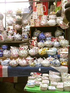 a table topped with lots of plates and bowls