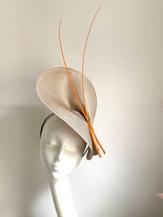 Beige Feather Hat A beige Hat will be an amazing accessory to compliment your outfit. It's elegant and simple. The beige hat will fit the average head size. Its made from a fabric-covered headband attached to the polybraid saucer base on which sits two orange color feathers. To secure your fascinator there is a comb inside the hat attached to the headband, so the fascinator sits very securely on your head. Enjoy your special day with this beautiful headpiece! Luxury Beige Fascinator For Royal Ascot, Luxury Beige Brimmed Fascinator, Beige Adjustable Fascinator For Kentucky Derby, Beige Curved Brim Hat For Royal Ascot, Beige Short Brim Fascinator For The Beach, Beige Short Brim Fascinator For Beach, Beige Boater Hat With Curved Brim For Races, Summer Beige Wide Brim Fascinator, Beige Adjustable Wide Brim Fascinator